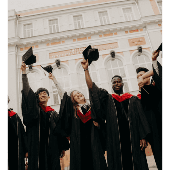 A group of people in graduation robes and hats.